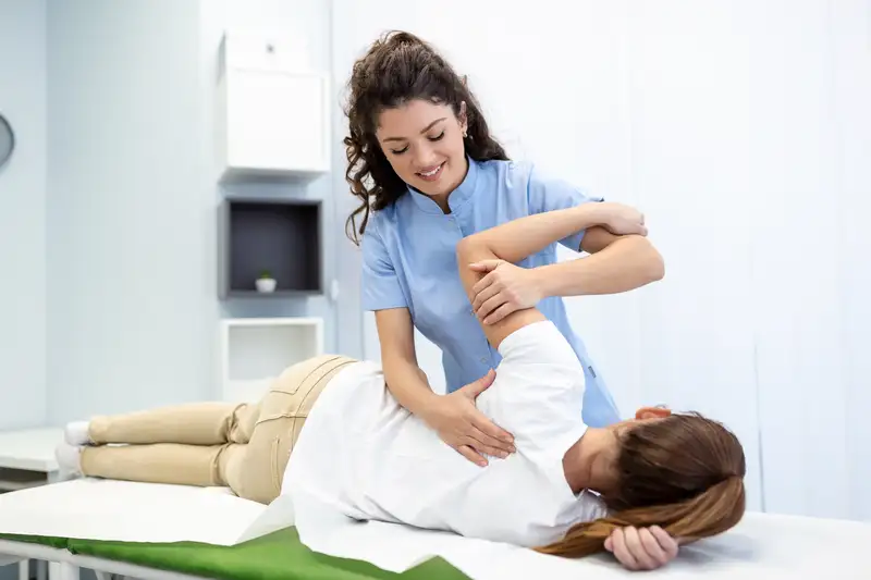 A chiropractor working with a patient