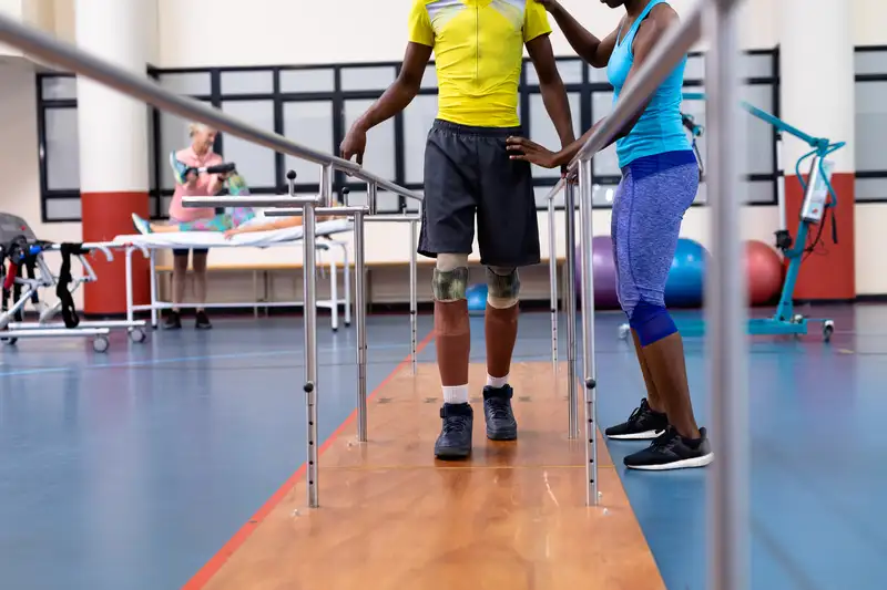 A physiotherapist working through rehab with a patient